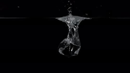 Ice Cube Splashes into Dark Water