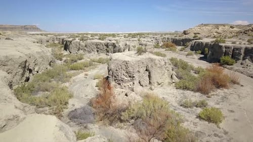 Aerial view flying over dry wash in the Utah desert