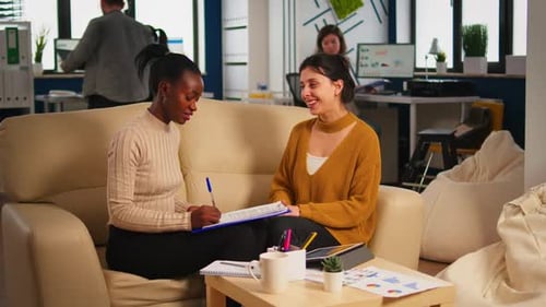 Two Business Women Meeting and Shaking Hands