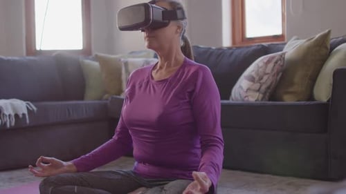 Senior Woman Meditating with Virtual Reality Headset