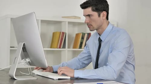 Businessman Working On Computer in Office