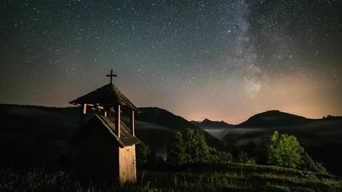 Chapel Under Starry Night Sky in Rural Setting