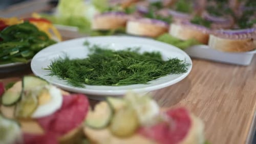 Fresh Appetizers with Salami and Dill on Table