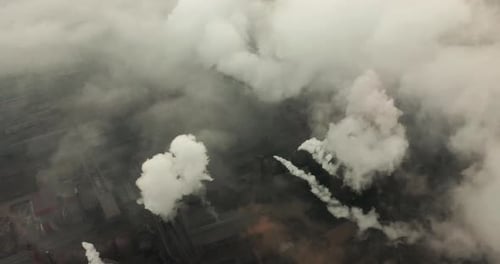 Top View of the Metallurgical Plant. Smoke Coming Out of Factory Pipes. Ecology