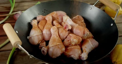 Chicken Drumsticks Seasoned in Rustic Kitchen Setting