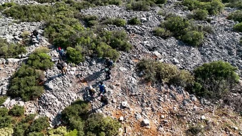 Group Hiking on Rocky Hillside