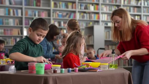Children Making Slime in the Library with Adult
