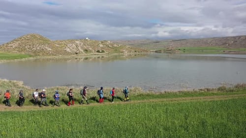 Trekking By The Lake In Aerial View