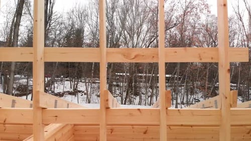 House Construction with Wooden Beams on Winter Day