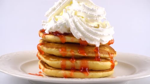 Pancakes Stack with Syrup and Whipped Cream