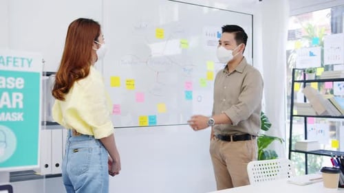 Business Professionals Greet Safely at the Office