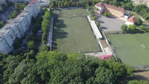 Aerial View of Soccer Stadium in the City Between the Blocks