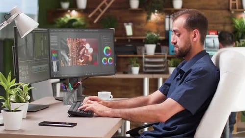 Man working at computer in an indoor office