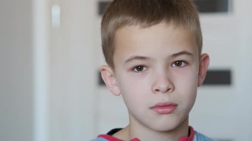 Child Smiling and Looking at Camera Close Up