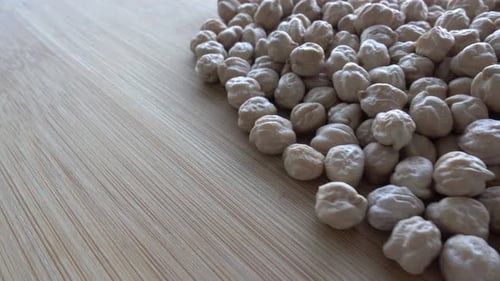 Pile of Dried Chickpeas on Wooden Surface