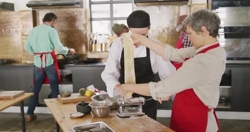 Chefs making pasta dough