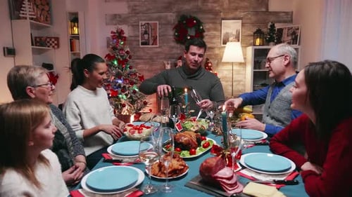 Family Celebrates Christmas with Dinner at Home