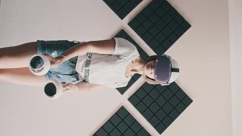 Woman Experiences Virtual Reality with Headset and Controllers