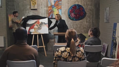 Art Presenter Reveals Painting to Gallery Audience