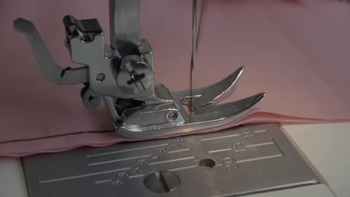 Sewing Machine Stitches Pink Fabric