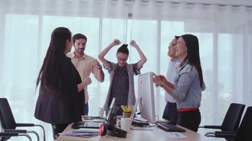 Successful Business People Celebrating Project Success at Office