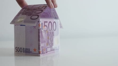 Putting roof on European Union paper money made house 4K 21650p 30fps UltraHD tilting footage - Slow