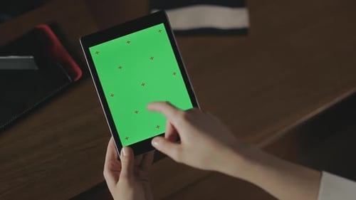 Female Hand Using Green Screen Tablet. Business Woman Touching Tablet Screen
