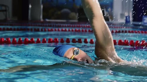 Attractive Young Swimmer in the Swimming Pool