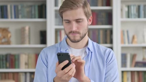Portrait of Man Using Smartphone