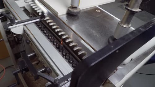 Woodworking Machine Drilling Holes in Factory Workplace