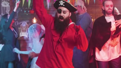 Halloween Party with People in Diverse Costumes Dancing