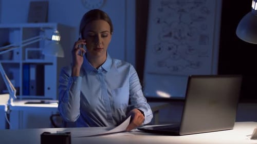 Businesswoman Calling on Smartphone at Dark Office 93