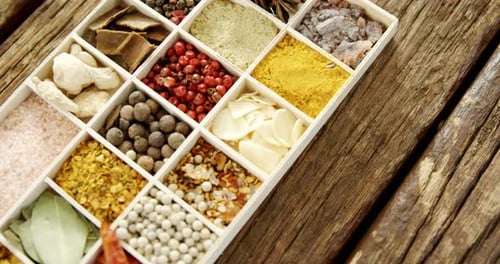 Assorted Colorful Spices in White Divided Tray