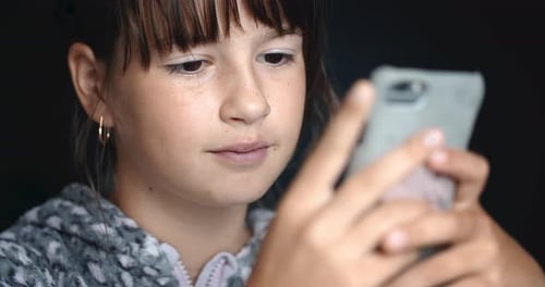 Girl Using Smartphone Technology in a Close-Up Shot