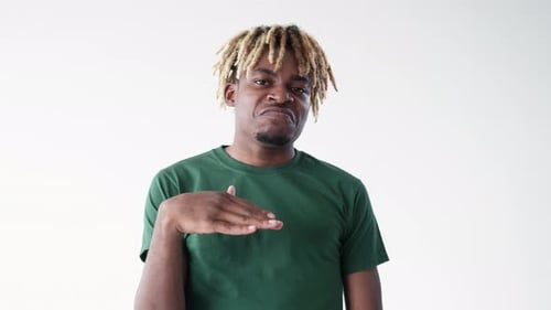 Man with Blonde Dreads Making a Hand Gesture