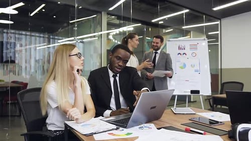 Dynamic Team Meeting in Modern Office Setting