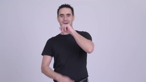 Man Gesturing and Smiling in Studio Portrait