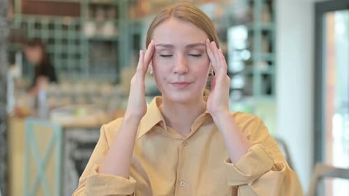 Portrait of Stressed Young Woman Having Headache