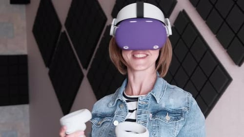 Woman Using Virtual Reality Headset with Controllers