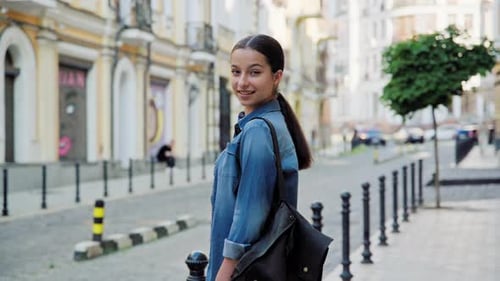 Young Woman Smiling on City Street
