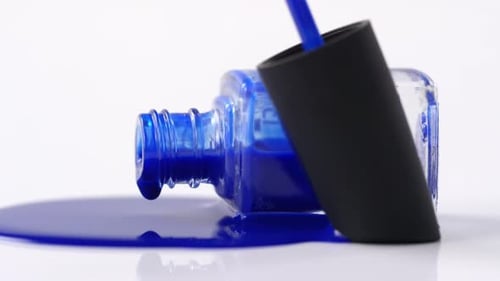 Close Up: Blue Nail Polish Spilling