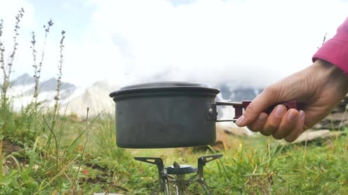 Pot Placed on Burner During Outdoor Adventure