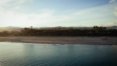 Sandy Coast near the Calm Ocean