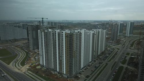 Construction of modern multi-storey buildings. Construction of a new city block.