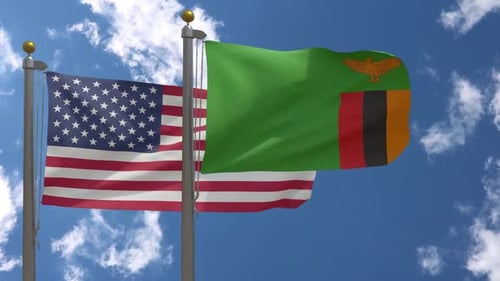 United States and Zambia Flags Waving against a Clear Sky