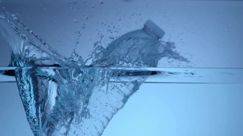 Bottle Dropping Into Water Creating Splash
