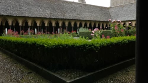 Mont-Saint-Michel gardens on top abbey Normandy France 4K 3840X2160 UHD slow tilting video - Mt Sa
