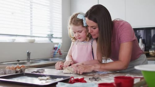 Mother and Child Baking Together in Sunny Kitchen