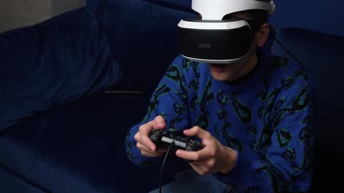 Young Adult Man Using Virtual Reality Headset