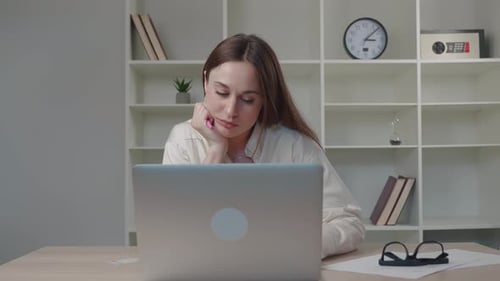 Worried Business Woman Face Looking at Laptop in Office